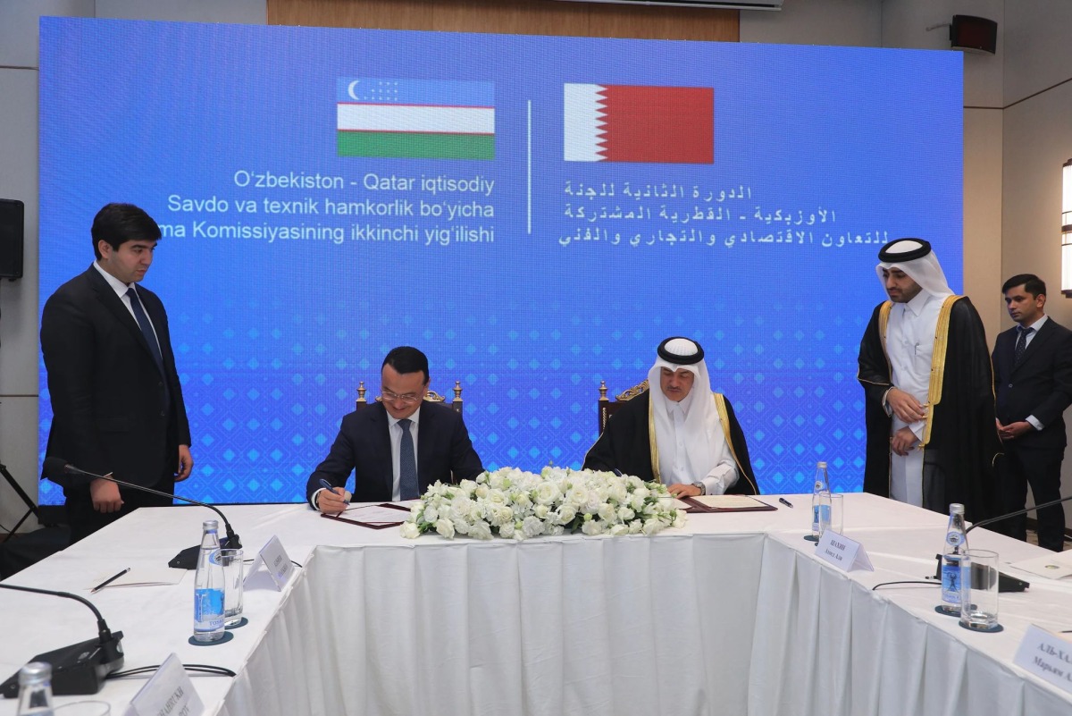 Minister of State for Foreign Trade Affairs, H E Dr. Ahmed bin Mohammed Al-Sayed, and Minister of Investment, Industry and Trade of Uzbekistan, H E Laziz Kudratov, during the signing ceremony.
