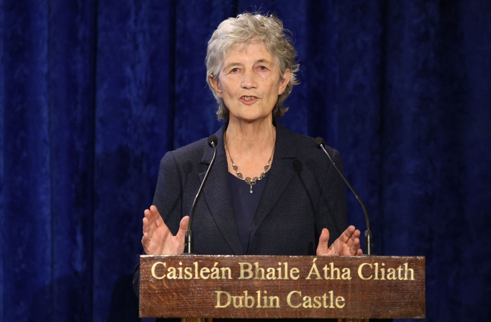 President-elect Catherine Connolly speaks after being declared the winner of the Irish presidential election at Dublin Castle in Dublin on October 25, 2025. (Photo by Paul Faith / AFP)