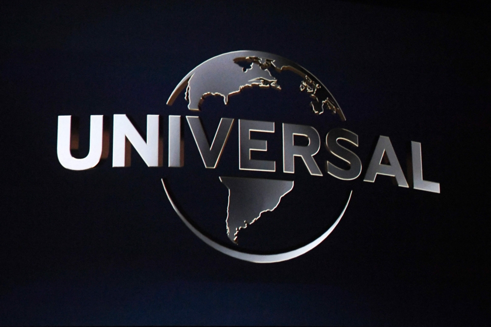 The Universal logo is displayed on a screen during a Universal Studios special presentation during CinemaCon 2022 at Caesars Palace in Las Vegas, Nevada, on April 27, 2022. (Photo by Valerie Macon / AFP)