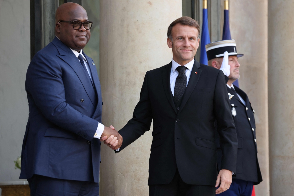 France's President Emmanuel Macron welcomes Democratic Republic of the Congo's President Felix Tshisekedi before a meeting at The Elysee Presidential Palace in Paris on October 30, 2025, on the sidelines of the Paris Peace Forum. (Photo by Ludovic Marin / AFP)