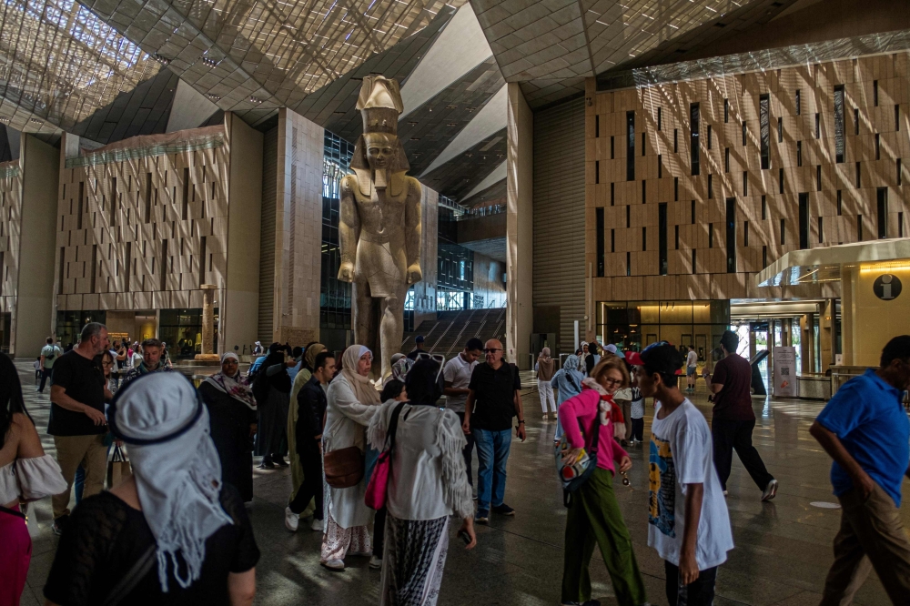 (Files) Visitors tour the Grand Egyptian Museum in Giza on the southwestern outskirts of the capital Cairo on May 5, 2025. (Photo by Khaled Desouki / AFP)
