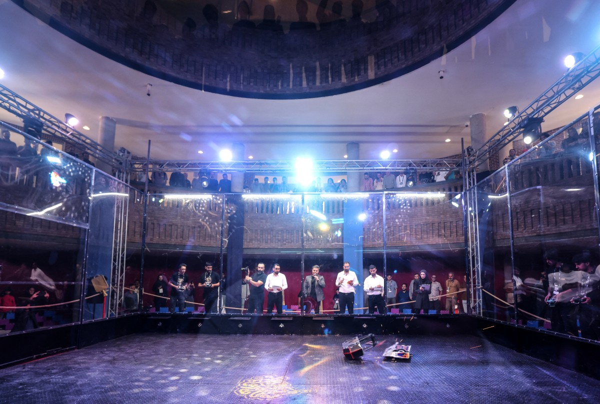 Engineering students compete in a robot combat contest on the eastern outskirts of Tehran on October 28, 2025. (Photo by Atta Kenare / AFP)
