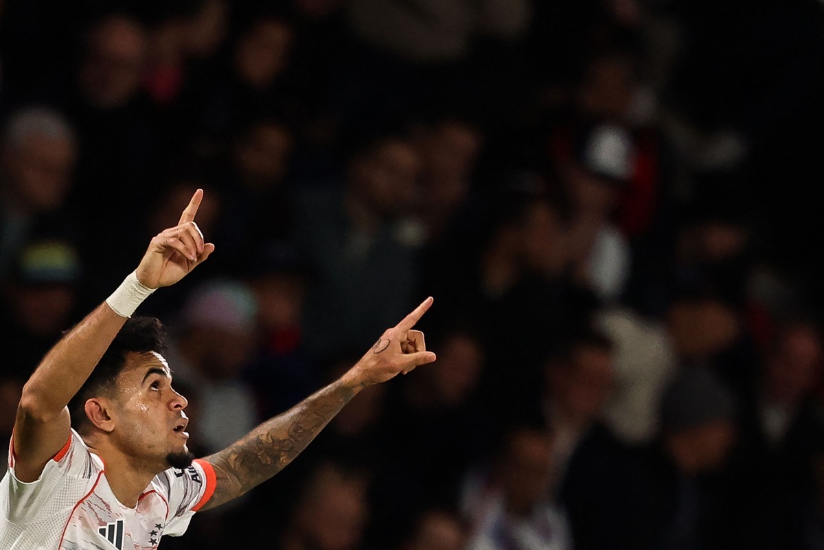Bayern Munich's Colombian forward #14 Luis Diaz celebrates scoring his team's second goal during the UEFA Champions League, league phase day 4, football match between Paris Saint-Germain (PSG) and FC Bayern Munich at the Parc des Princes in Paris, on November 4, 2025. (Photo by FRANCK FIFE / AFP)