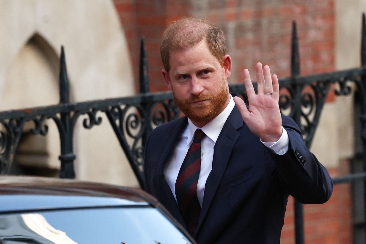 Britain's Prince Harry, Duke of Sussex waves as he departs the the Royal Courts of Justice, Britain's High Court, in central London, on April 9. Photo by HENRY NICHOLLS / AFP