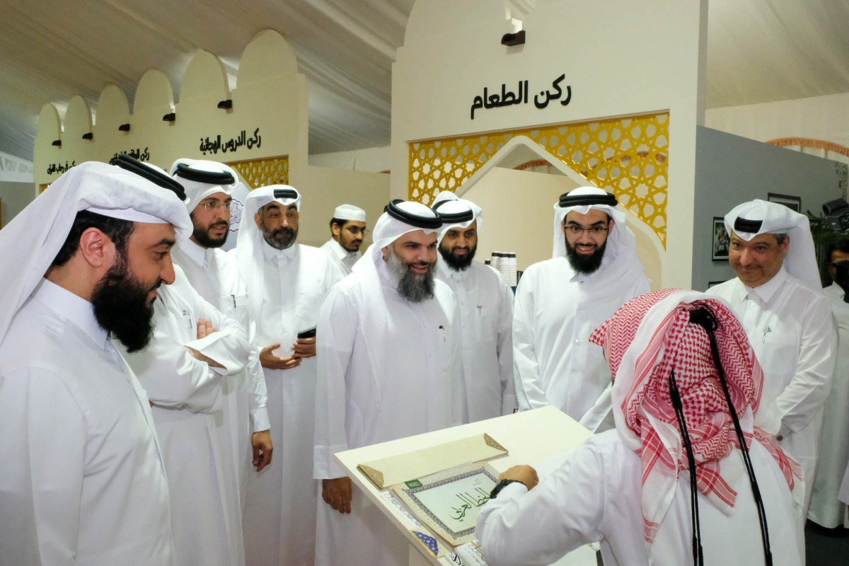 Undersecretary of the Ministry of Awqaf and Islamic Affairs H E Dr. Sheikh Khalid bin Mohammed bin Ghanem Al-Thani during a tour of the exhibition. 