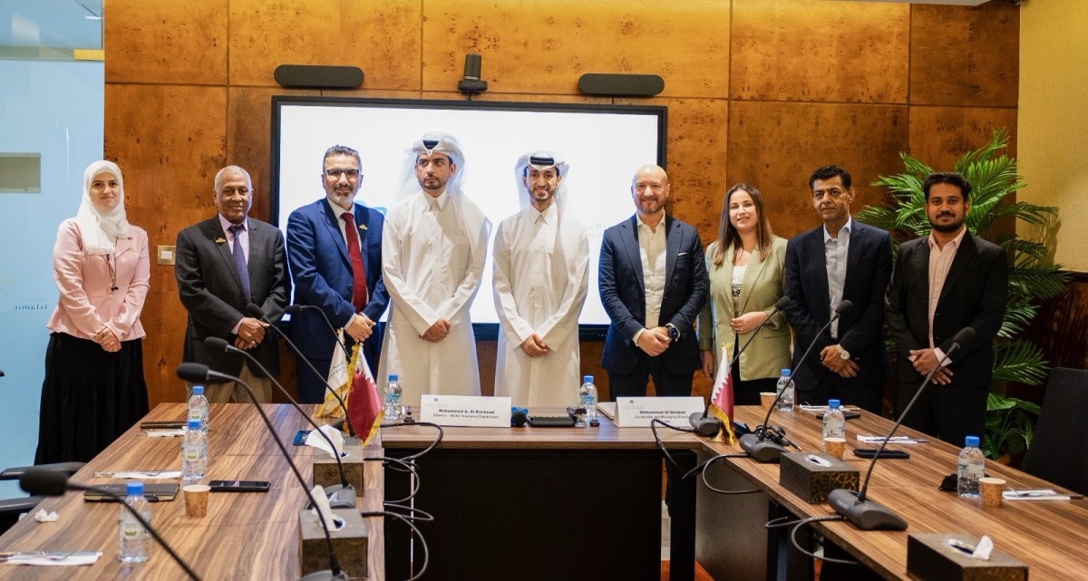 Executive Director of Motor Insurance at Qatar Islamic Insurance Group, Mohammed Al-Rasheed and Co-Founder of PayLater Mohammad Al Dulaimi with other officials during the signing ceremony.