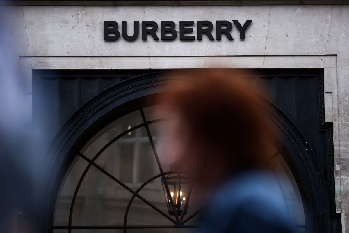 Pedestrians walk past the store of British fashion label Burberry in central London on September 2, 2024. Photo by HENRY NICHOLLS / AFP