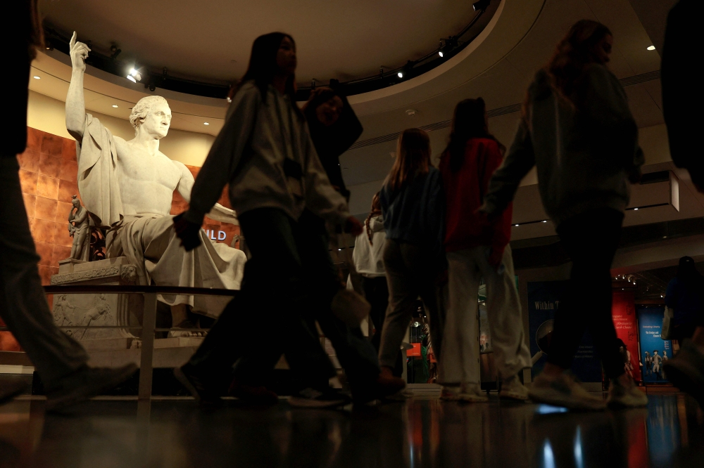 Visitors walk through the recently re-opened National Museum of American History on November 14, 2025 in Washington, DC. Heather Diehl/Getty Images/AFP 