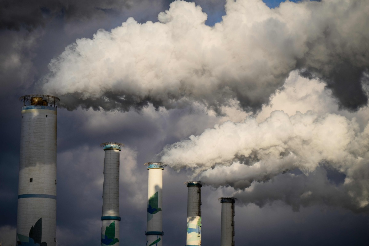 A general view shows exhaust gases billowing from the chimneys of the Taean Thermal Power Station, a large coal-fired power station owned by Korean Western Power Co, part of Korea Electric Power Corporation, in Taean, around 150 kilometers from Seoul, on November 17, 2025. Photo by ANTHONY WALLACE / AFP