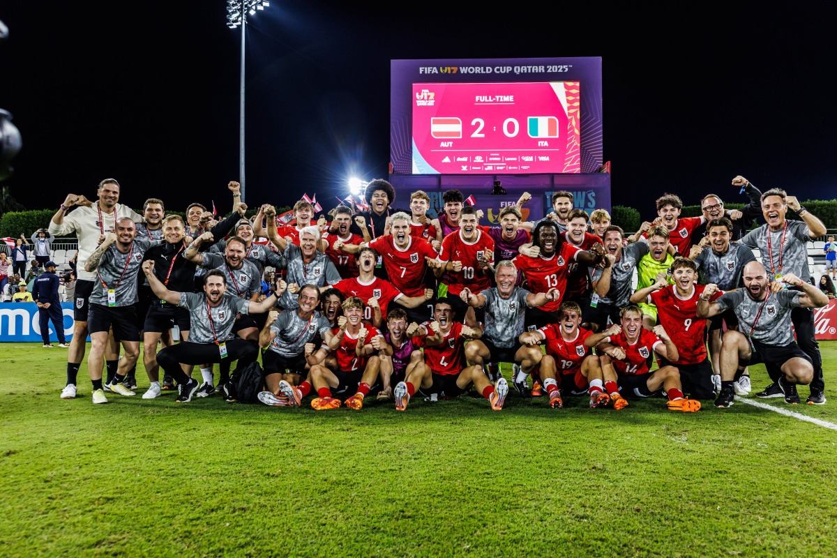Austria players and officials celebrate.