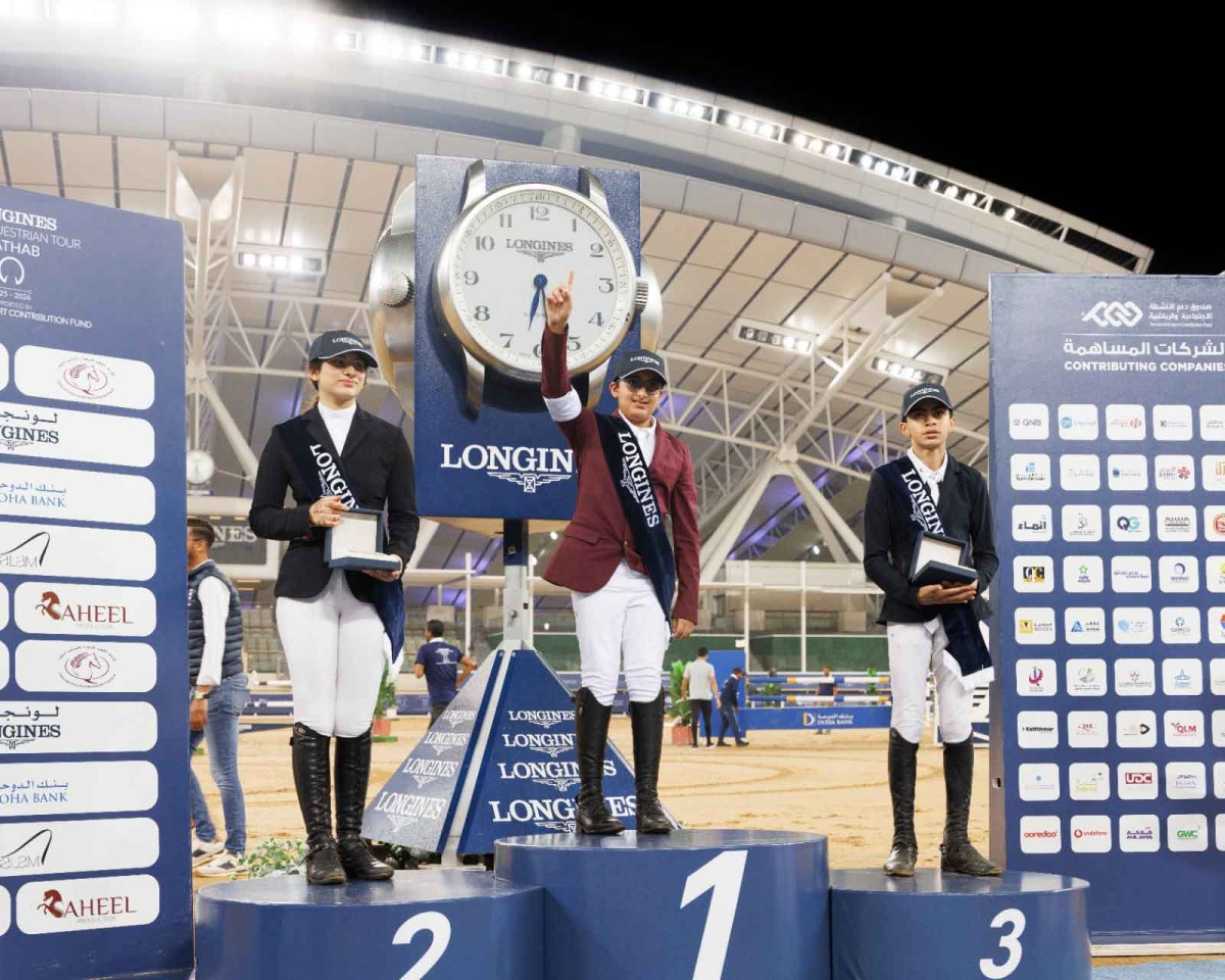 The podium winners of Amateur class celebrate on the podium.