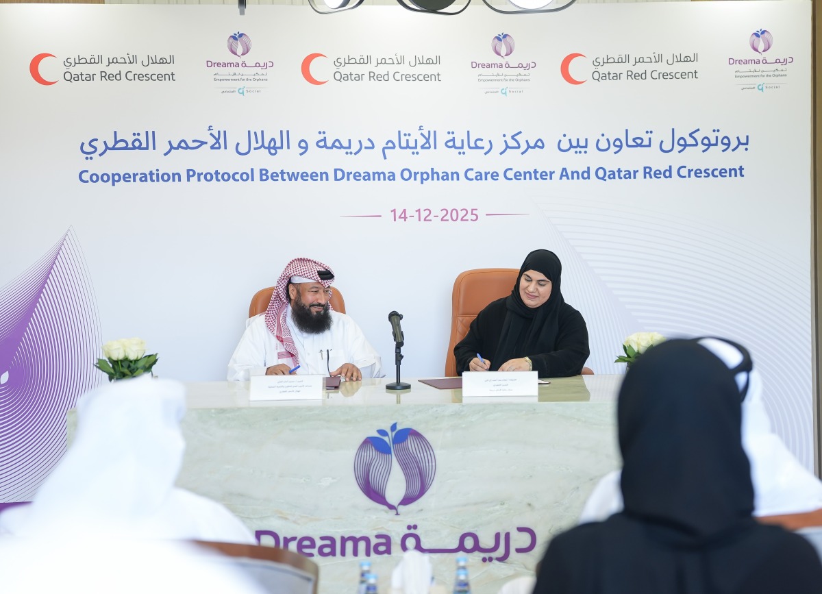 Officials from Dreama and QRCS signing the cooperation protocol.