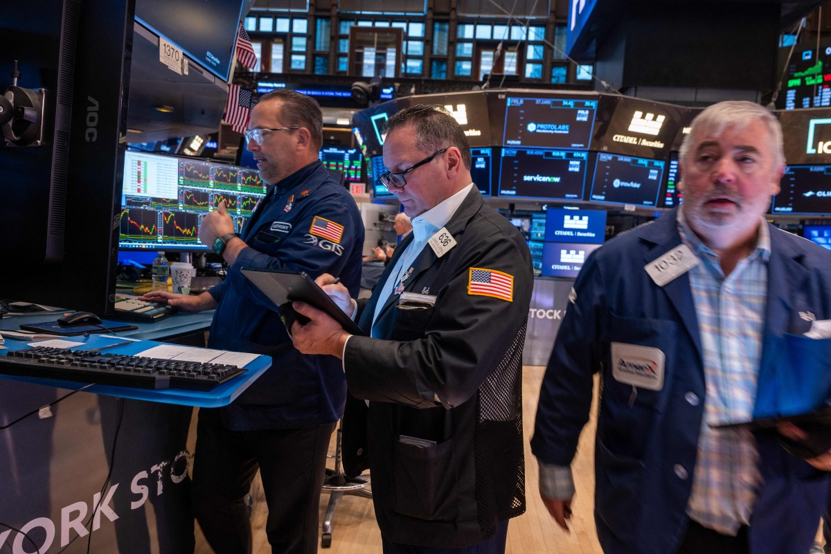 Traders work on the floor of the New York Stock Exchange in New 
York City, US. 