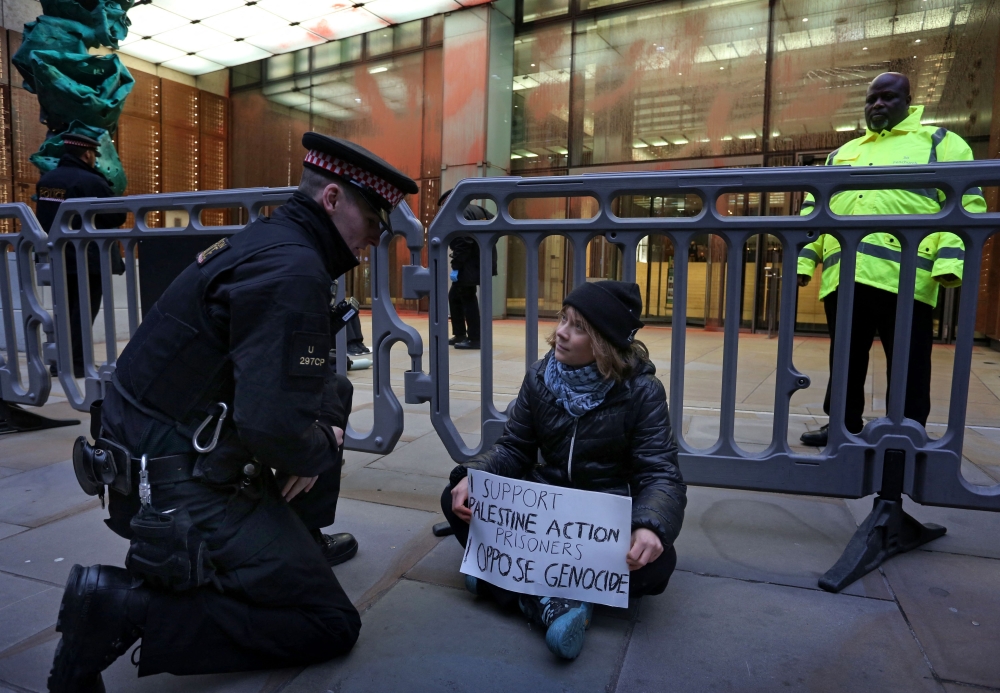 A handout photograph taken on and released by Prisoners for Palestine in London on December 23, 2025 shows Swedish activist Greta Thunberg before her arrest at Plantation Place on Fenchurch Street. (Photo by Prisoners for Palestine / AFP) 