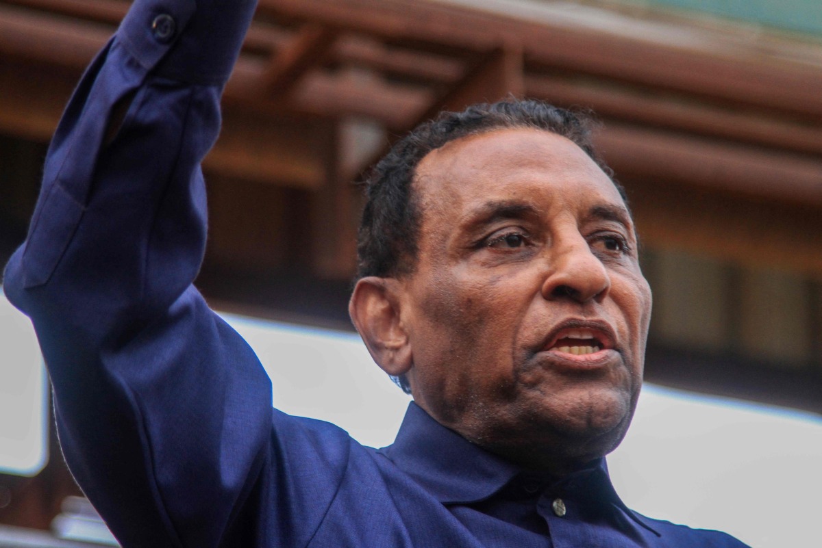Kamil Idris, a former UN official who was appointed in May as prime minister by Sudan's de facto leader Abdel Fattah al-Burhan, addresses people and local fighters supporting the Sudanese army who came to cheer him on, during a visit in Omdurman on July 19, 2025. (Photo by Ebrahim Hamid / AFP)