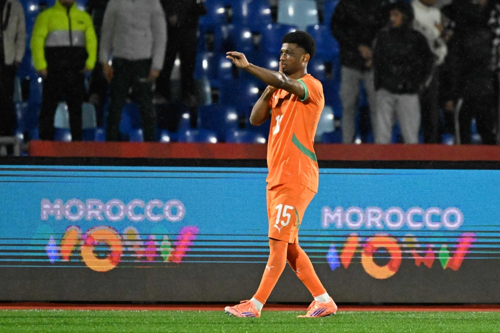 Ivory Coast's forward #15 Amad Diallo celebrates scoring the team's first goal during the Africa Cup of Nations (CAN) Group F football match between Ivory Coast and Mozambique at Marrakesh Stadium in Marrakesh on December 24, 2025. (Photo by Khaled Desouki / AFP)