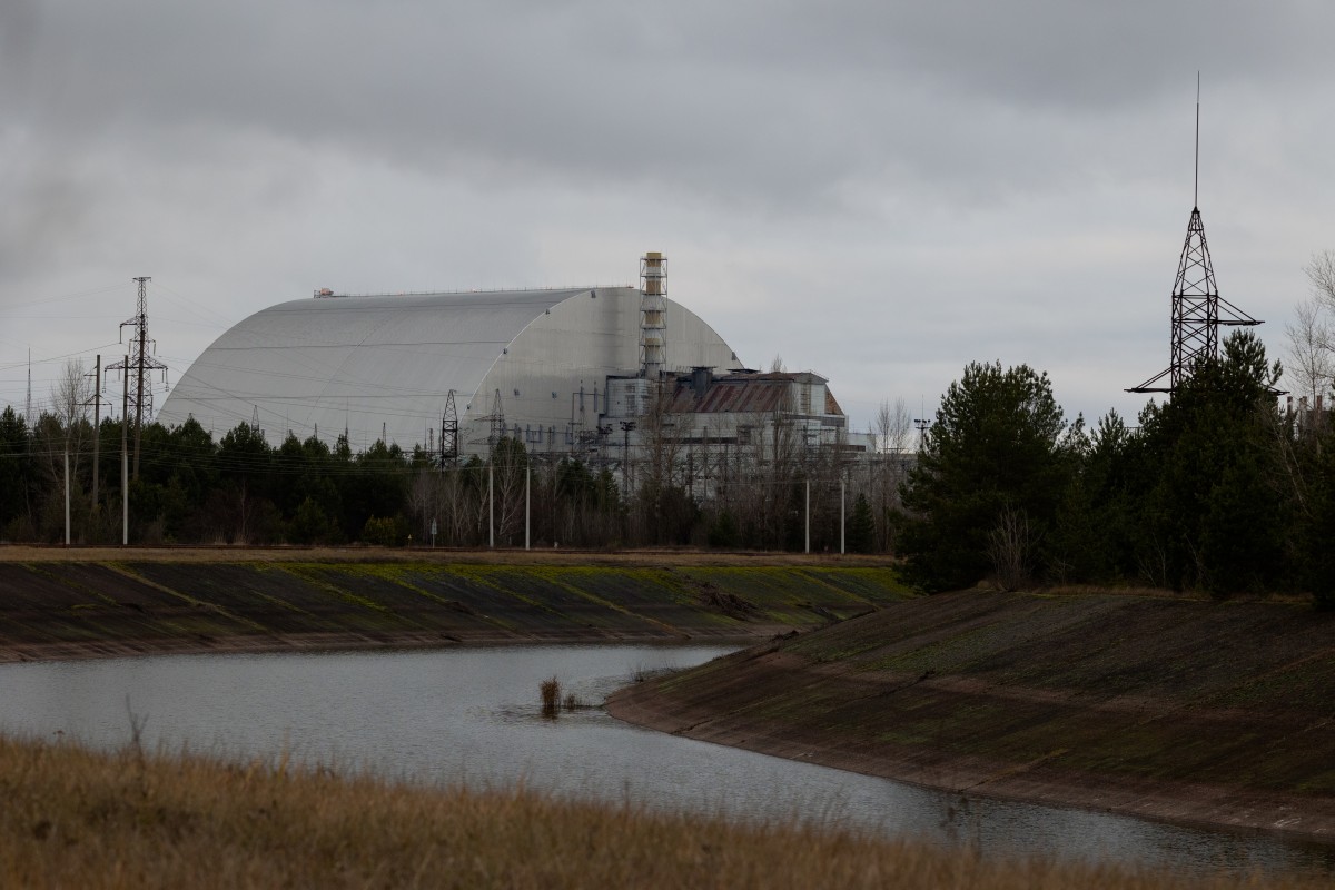 This photograph shows the containment vessel of the New Safe Confinement (NSC) which contains radiation from the remains of reactor 4 of the former Chernobyl Nuclear Power Plant, in Chernobyl, on December 22, 2025, amid the Russian invasion of Ukraine. Photo by Tetiana Dzhafarova / AFP
