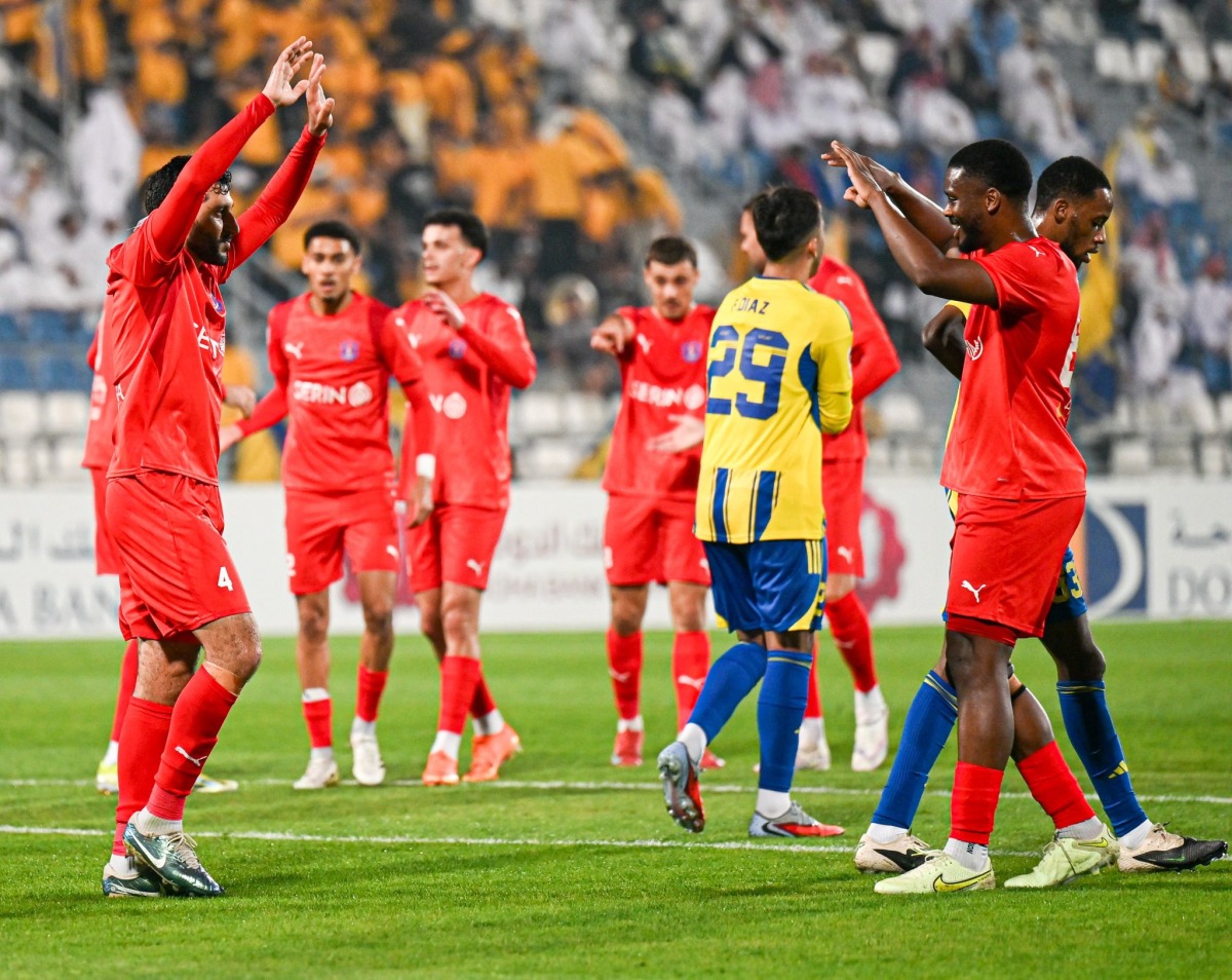 Al Shahania players celebrate Mohamed Bader Sayyar's (left) scored a goal.