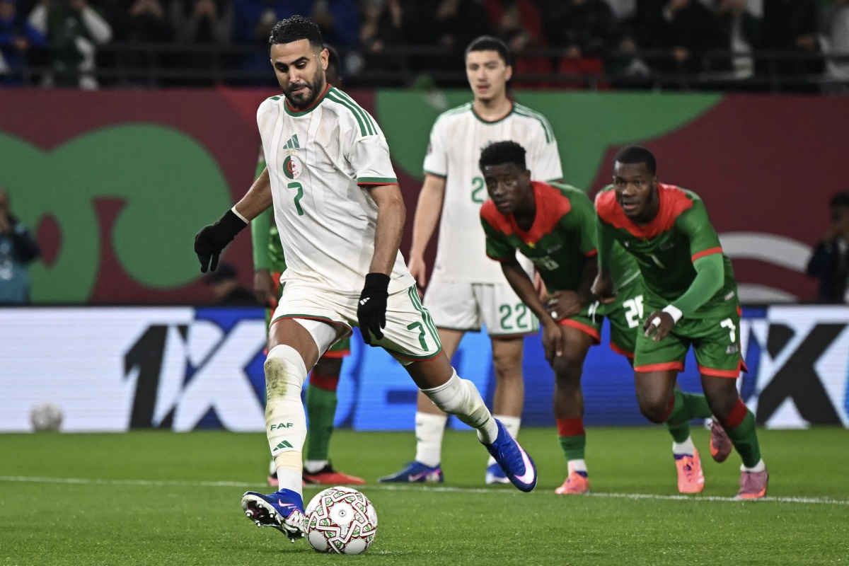 Algeria’s Riyad Mahrez shoots from the penalty spot.