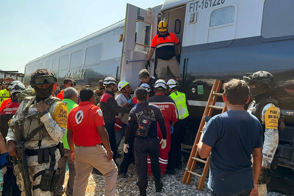 Mexican Army soldiers and Civil Protection members rescued passengers from the Interoceanic train that derailed in the Asuncion Ixtaltepec area on the route to Oaxaca, Mexico on December 28, 2025. (Photo by Rusvel Rasgado / AFP)