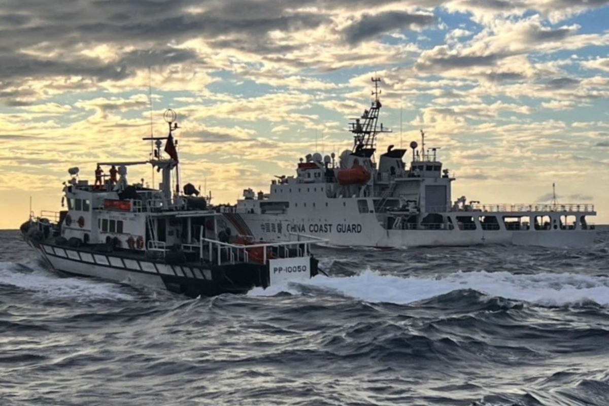 This is a handout photo taken on December 29, 2025 and released on December 30, 2025 by the Taiwan Coast Guard shows a Taiwanese coast guard ship (L) sending warnings to a Chinese coast guard ship in the waters off Taiwan's Cape Fugui. Photo by Handout / TAIWAN COAST GUARD / AFP