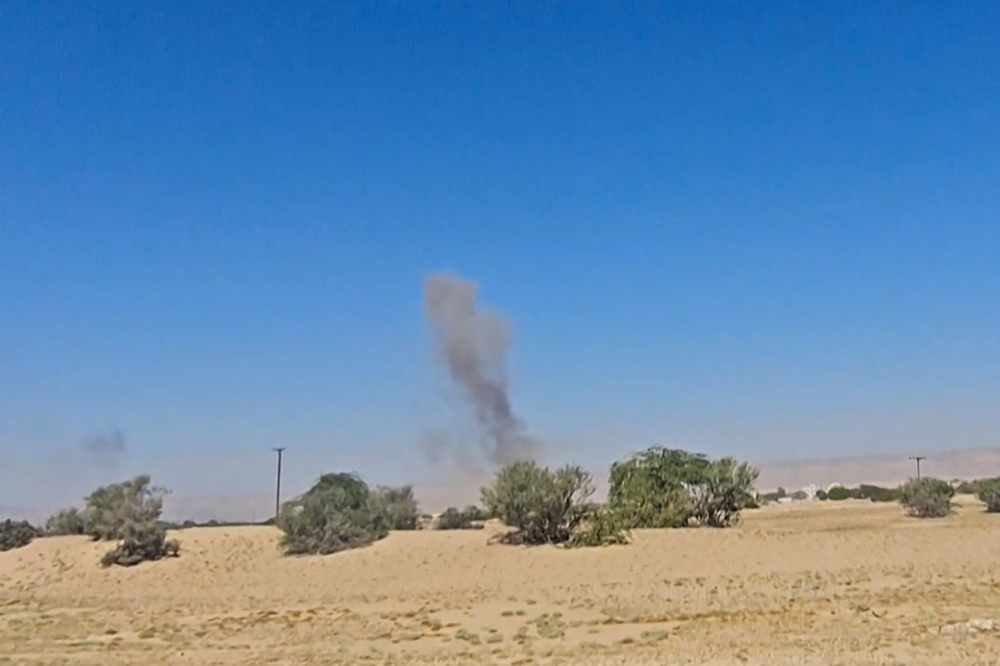 This image grab from an AFPTV footage shows smoke billowing after airstrikes in Yemen. (Photo by AFPTV / AFP)