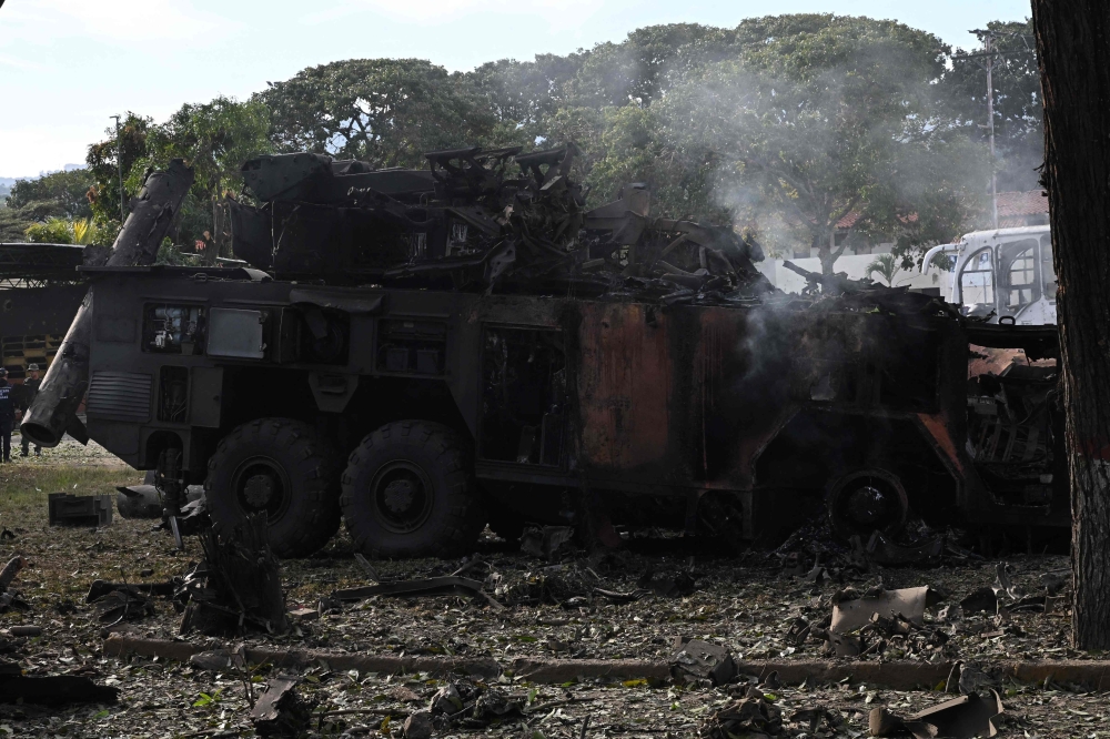 A burnt missile interceptor vehicle is seen at La Carlota air base in Caracas on January 3, 2026. (Photo by Federico Parra / AFP)