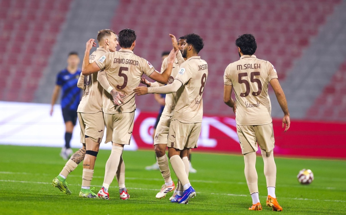 Al Rayyan's Roger Guedes (left) celebrates with teammates.