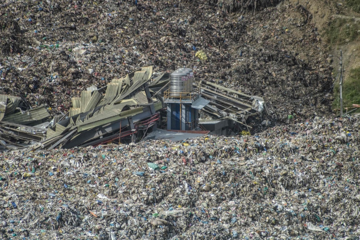 An aerial view shows a landslide at the landfill in Barangay Binaliw, Cebu City on January 9, 2026. Photo by Alan Tangcawan / AFP