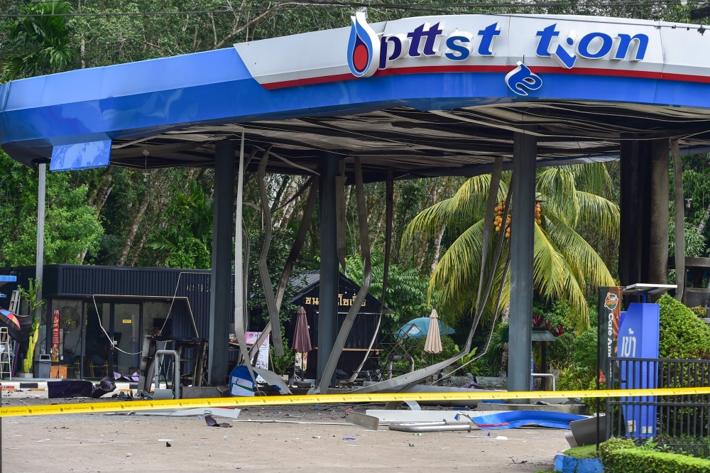 A general view shows the aftermath of a bomb attack at a PTT petrol station in Thailand's southern province of Narathiwat on January 11, 2026. (Photo by Madaree Tohlala / AFP)