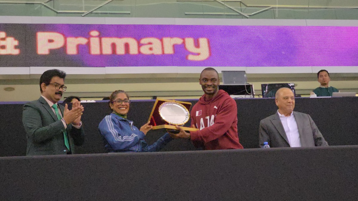 Birla Public School officials honouring Femi Seun Ogunode during the event.