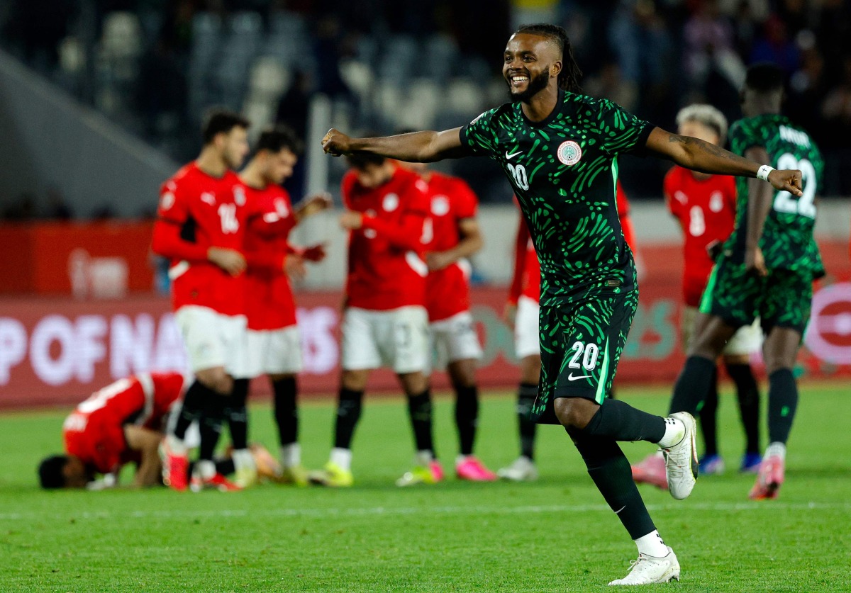 Nigeria's defender #20 Chidozie Awaziem celebrates after the penalty shoot out in the Africa Cup of Nations (CAN) third place football match between Egypt and Nigeria at the Mohammed V Stadium in Casablanca on January 17, 2026. (Photo by Abdel Majid BZIOUAT / AFP)