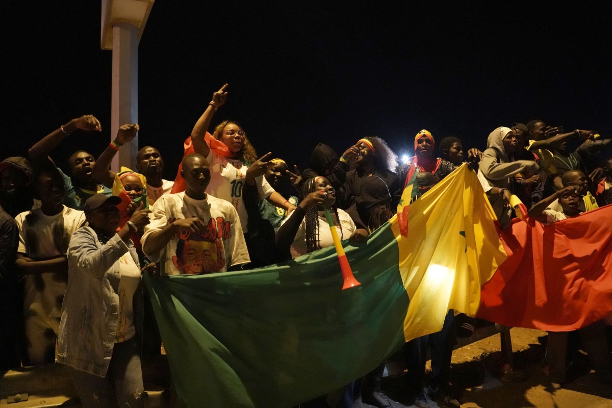 Supporters of Senegal痴 national football team celebrate their arrival in Dakar on January 20, 2026. Photo by Carmen Abd Ali / AFP