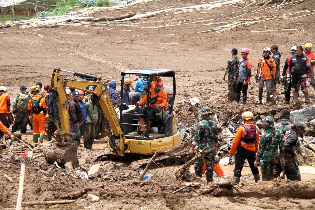 Rescuers work on-site after a landslide struck West Bandung Regency, West Java, Indonesia, Jan. 25, 2026. (Photo by Septianjar Muharam/Xinhua)