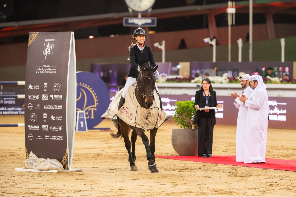 Kristen Vanderveen celebrates with her 12-year-old gelding Bull Run’s Jireh after winning the CSI5* jump-off 155cm class during the final round of the HH The Father Amir’s Prix at Al Shaqab yesterday. The winners of the class were presented trophies by Abdullah al-Qashouti, the tournament's Marketing and Communications Director.