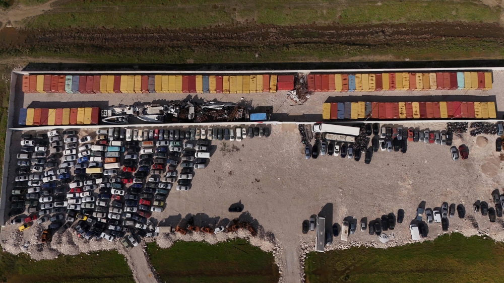 This aerial drone photograph shows containers of toxic industrial waste stored at a controlled site near the port city of Durres on November 8, 2025. (Photo by Adnan Beci / AFP)