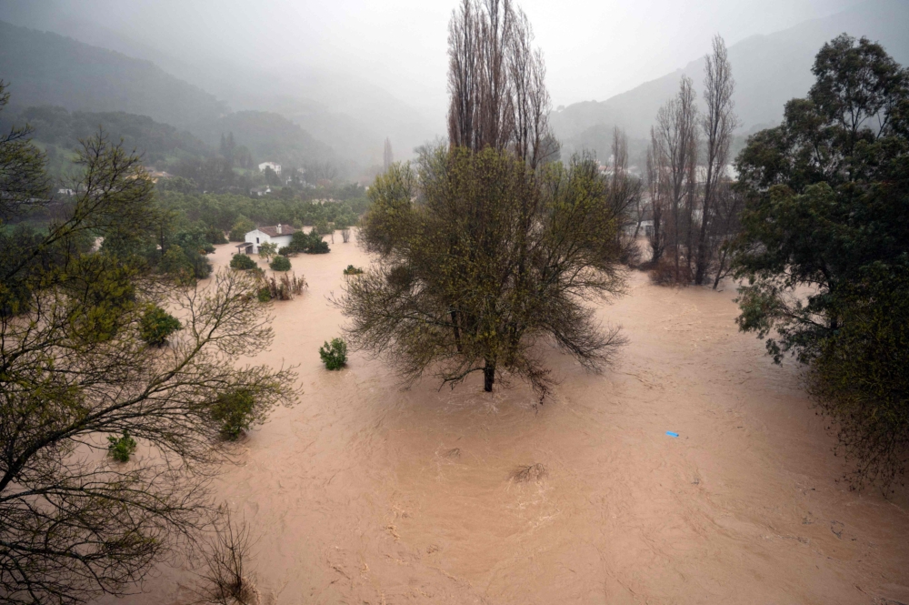 This picture shows a flooded area in Jimera de Libar, southern Spain, on February 4, 2026 amid Storm Leonardo. (Photo by Jorge Guerrero / AFP)