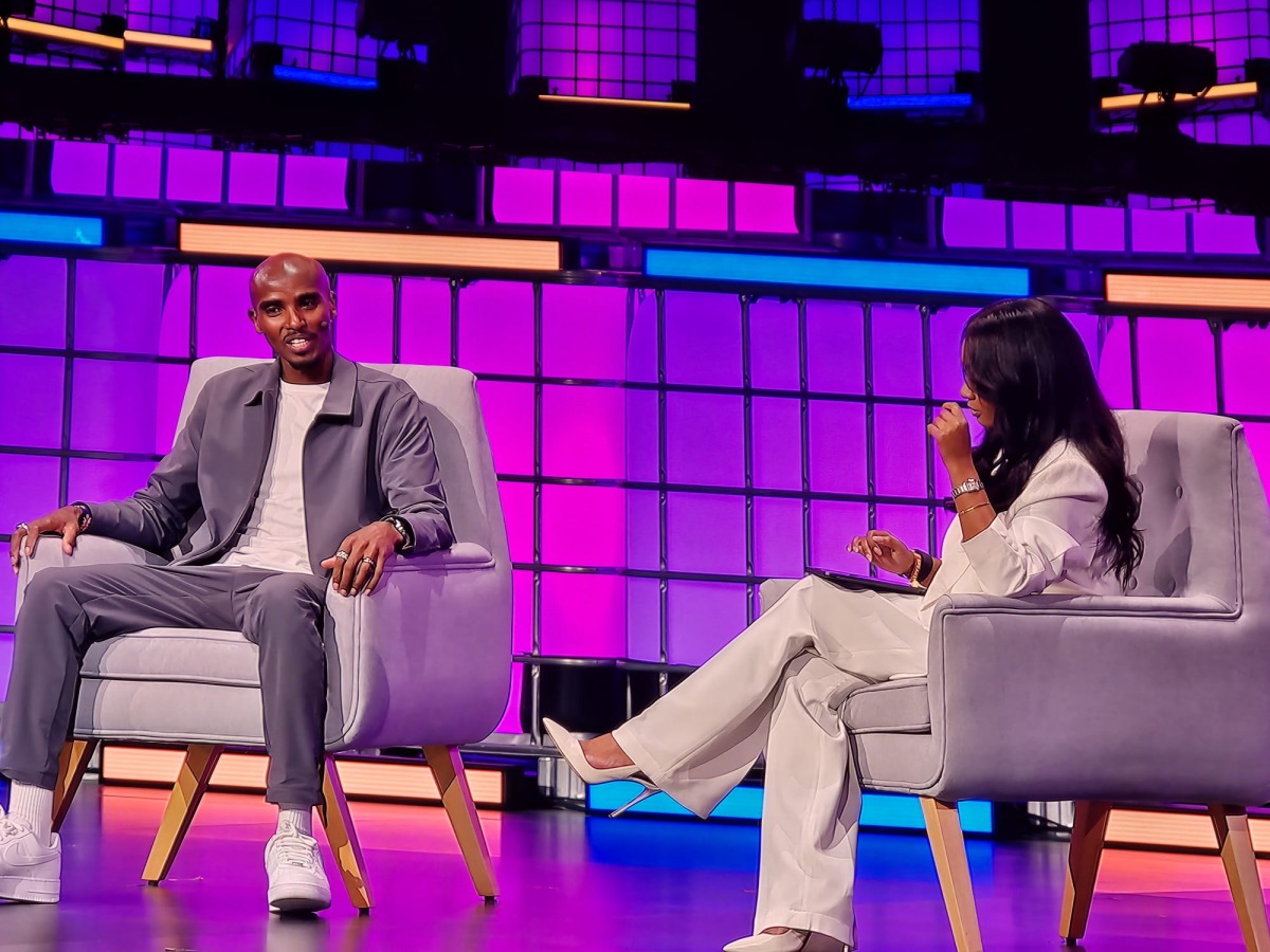 British athletics legend Sir Mo Farah with Al Jazeera’s Samantha Johnson during a session at the Web Summit Qatar 2026.