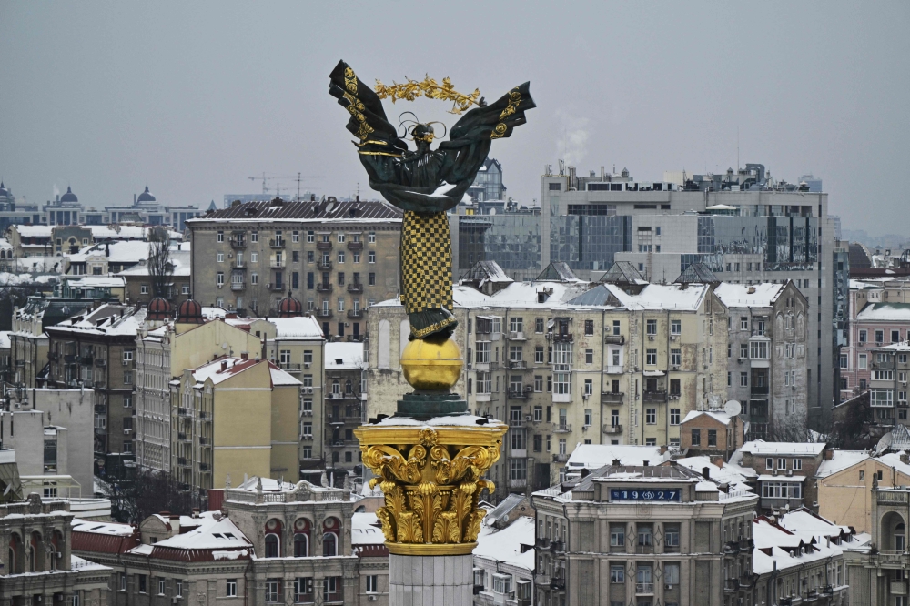 This photograph shows the Independence Monument towering over the Independence Square in Kyiv on February 6, 2026. (Photo by Genya Savilov / AFP)
