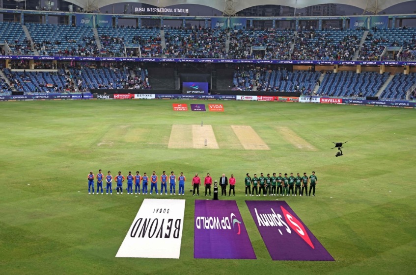 File photo: Indian and Pakistani players stand for their national anthem at the start of the Asia Cup 2025 Super Four Twenty20 international cricket match between India and Pakistan at the Dubai International Stadium in Dubai on September 21, 2025. (Photo by Fadel SENNA / AFP)