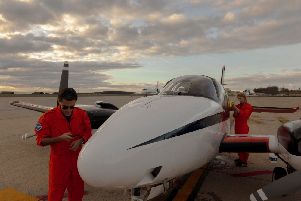 The crew of the Humanitarian Pilot Initiative (HPI) flight gets ready to the takeoff in Las Palmas on January 23, 2026. (Photos by Michele Cattani / AFP)