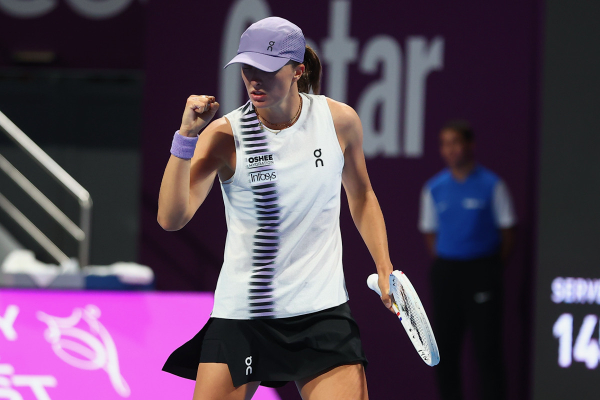 Poland's Iga Swiatek hits a return against Indonesia's Janice Tjen.