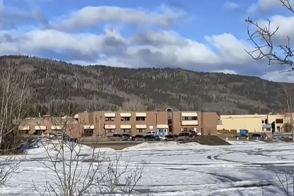 This screengrab of a video provided by local journalist Trent Ernst shows the middle school and high school building where a shooting took place, leaving at least nine people dead in the small town of Tumbler Ridge, British Columbia, on February 10, 2026. (Photo by Trent Ernst / AFP)