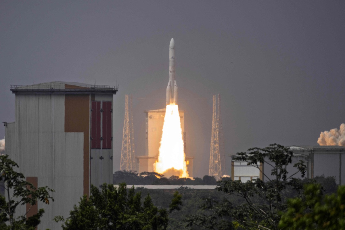 An Ariane 6 rocket carrying 32 satellites for the Amazon Leo constellation launches at the Guiana Space Centre in Kourou, on the French overseas department of Guiana, on February 12, 2026. (Photo by Ronan LIETAR / AFP)