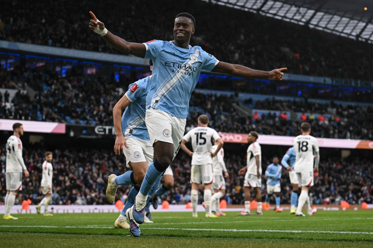 Manchester City's English defender #15 Marc Guehi celebrates after scoring a goal during the English FA Cup third round football match between Manchester City and Salford City at the Etihad Stadium in Manchester, north west England, on February 14, 2026. (Photo by Oli SCARFF / AFP)