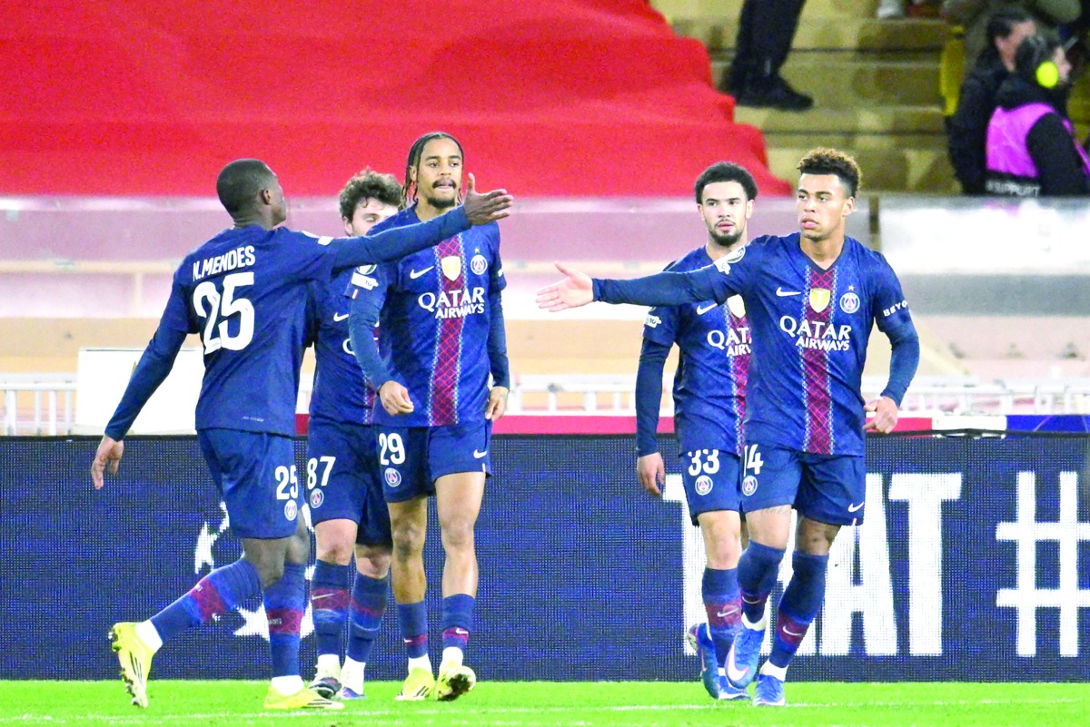Desire Doue (right) celebrates with teammates after scoring Paris Saint-Germain’s third goal against Monaco.