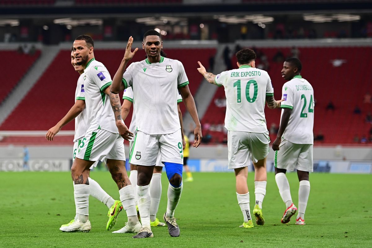 Al Ahli’s Sekou Yansane (foreground) celebrates his goal with teammates. 