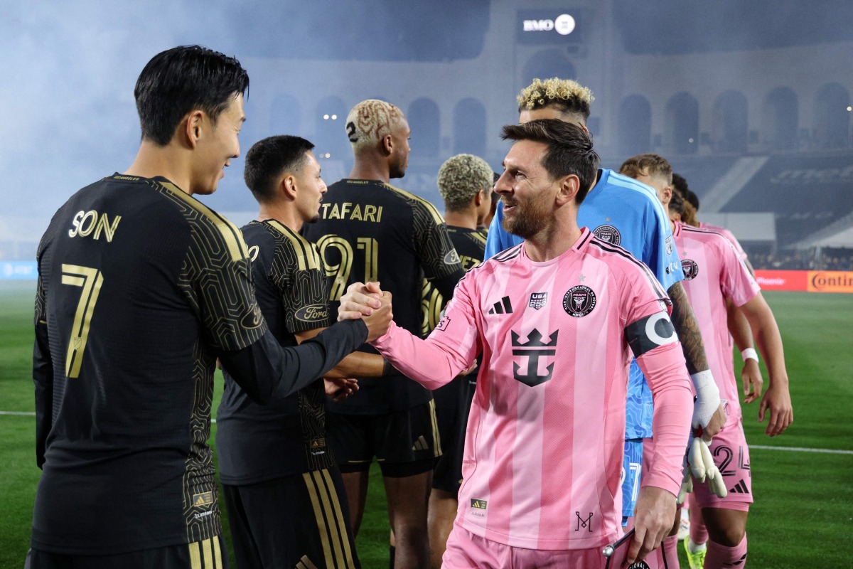 Lionel Messi #10 of Inter Miami CF. greets Son Heung-Min #7 of Los Angeles FC prior to the MLS match between Los Angeles Football Club and Inter Miami CF at Los Angeles Memorial Coliseum on February 21, 2026 in Los Angeles, California. Photo by KEVORK DJANSEZIAN / GETTY IMAGES NORTH AMERICA / Getty Images via AFP