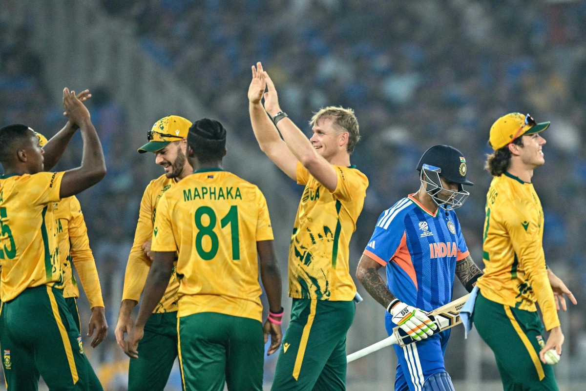 India’s captain Suryakumar Yadav (second right) walks off the field as South Africa’s players celebrate his dismissal.