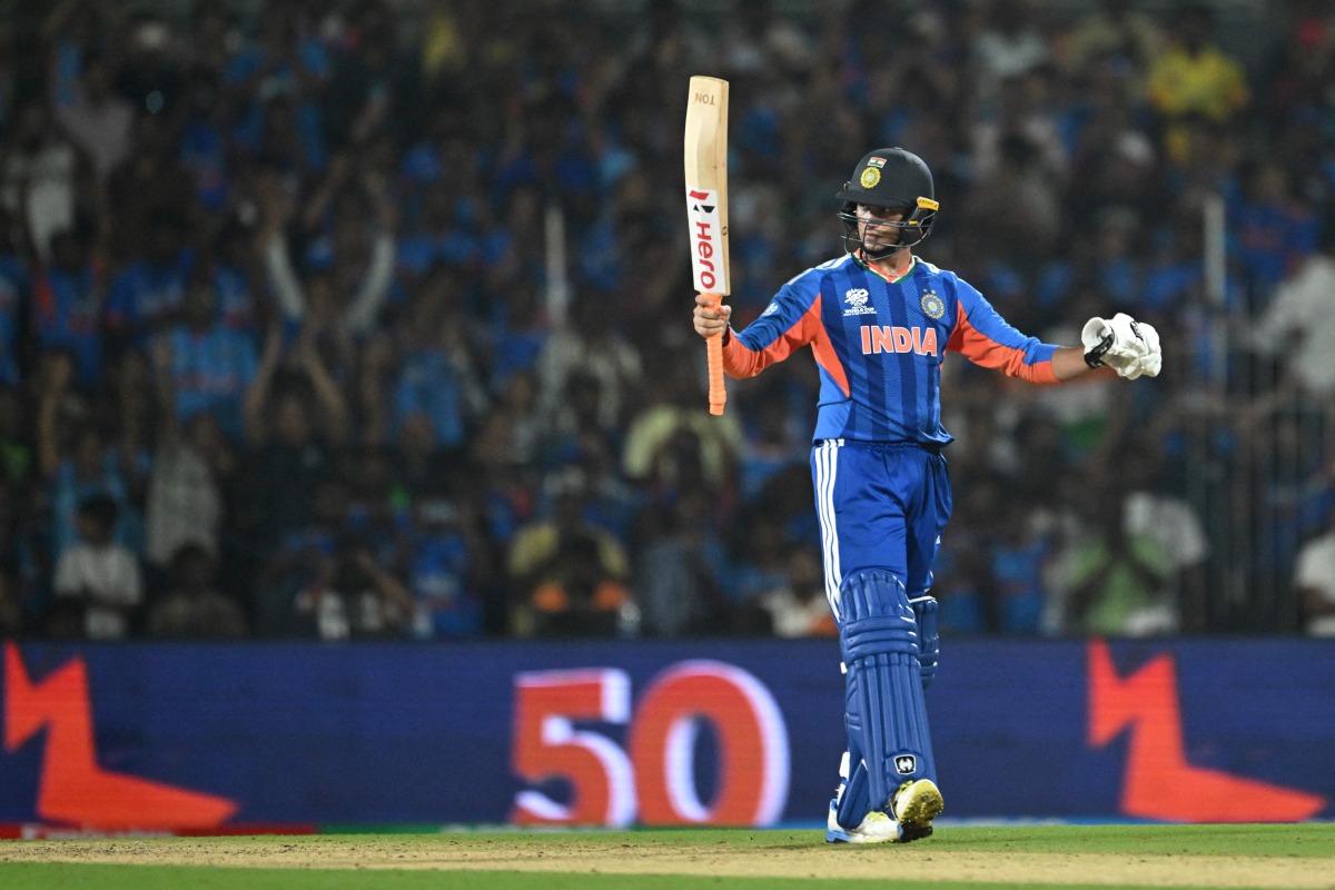 India's Abhishek Sharma celebrates after scoring a half-century during the 2026 ICC Men's T20 Cricket World Cup Super Eights match between India and Zimbabwe at the MA Chidambaram Stadium in chennai on February 26, 2026. (Photo by R. Satish BABU / AFP)
